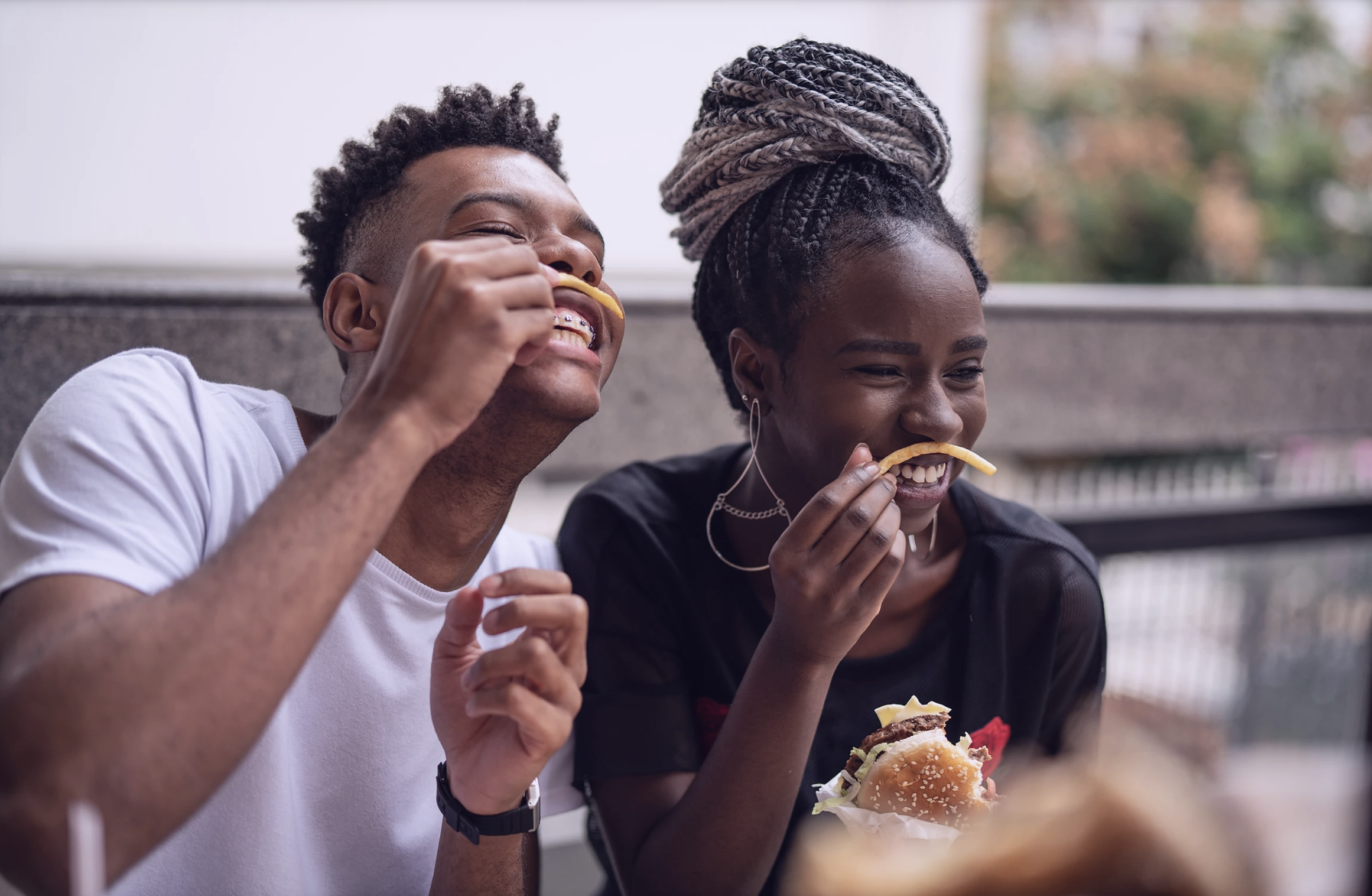 People enjoying french fries.